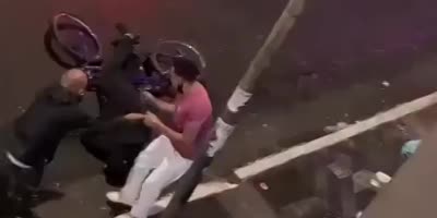 Brazil - A thief on a bicycle is shot in the head after stealing a cell phone(R)