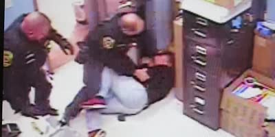 Ohio officer and a theft suspect struggling for a gun