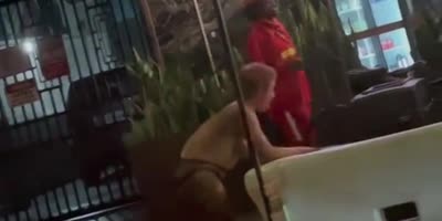 Topless Woman Washes In Public In LA