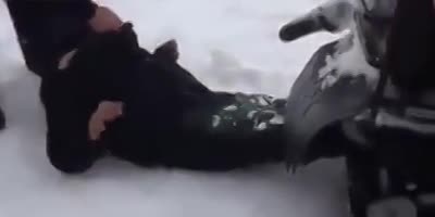 Man Gets Sucked In A Snowmobile.
