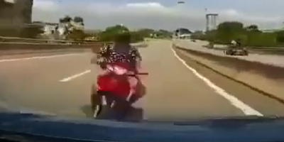 Biker Meets Hood Of Car In Malaysia