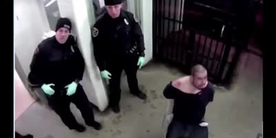 Handcuffed Suspect Beaten Up For Spitting On Cops.