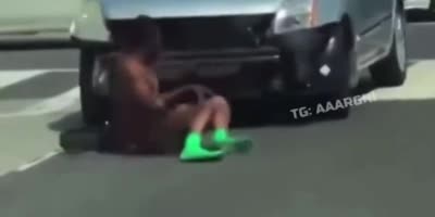 Naked guy beats the shit out of a car.