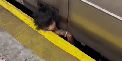 Asian Woman Survives In NY Subway Accident