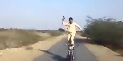 Crazy Pakistani Doing Crazy Stunt On A Bike.