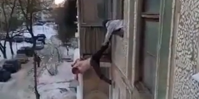 Intoxicated Junkie Held By Old Mother Falls Off Rather Low Height In Depressive Russia