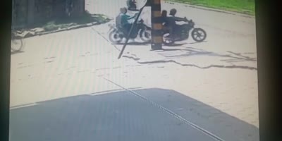 Couple Riding A Motorcycle Shot On The Road.