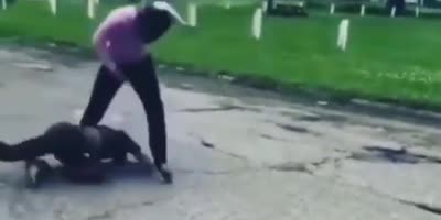 Girl gets slammed on asphalt.