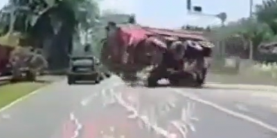 Dump Truck Flips Crushing Car Occupants In Indonesia