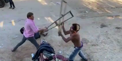 Disabled Man Donates His Crutches For Street Fight In Colombia