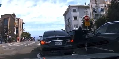 San Francisco Man Flung onto Street Attempting to Stop Car Burglary