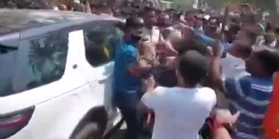 Indian deputy runs over protesters and is beaten