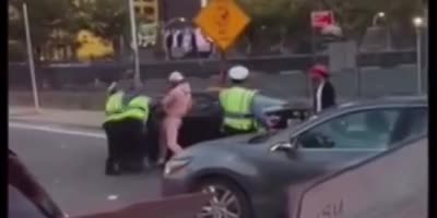 Guy in pink woops some police ass!