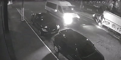 Biker Tries to Overtake Car, Loses Control into Trailer