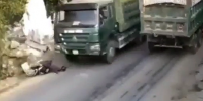Woman Falls Under Wheels Of Truck