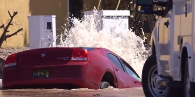 Car Crashes into Fire Hydrant Creates Sink Hole