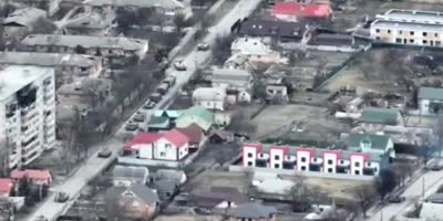 Drone footage shows Russian tank open fire on cyclist in Bucha