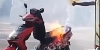 Idiot Pours Water Over An Electric Motorcycle On Fire.