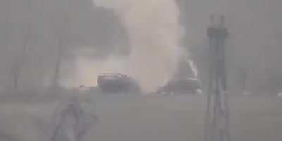 Two military supply trucks are being destroyed by ATGM strikes