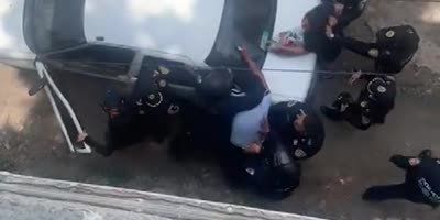 Pack Of Mexican Cops Punching Man Next To His Wife