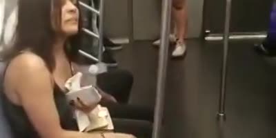 Brazen Bitch Grabs Random Woman By Hair On NY Subway Train