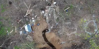 Russian Forces throwing grenades into a Ukrainian Soldiers Trench.