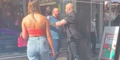 Bald Guys Throwing Hands Outside The UK Bar