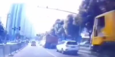 Car Gets SandWitched Between Two Trucks In China