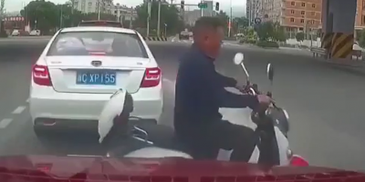 Careless Scooter Rider Meets Black SUV In China