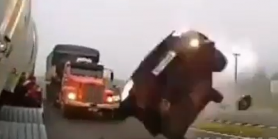Driver Manages to Flip Car After Clipping Truck