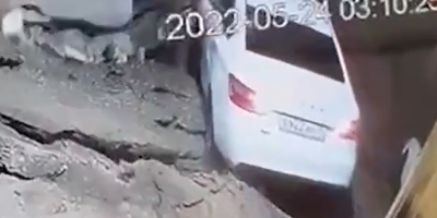 Driver Survives After House Falls On Car In Dagestan, Russia