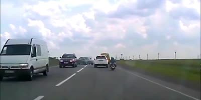 Motorcyclist rides through crash