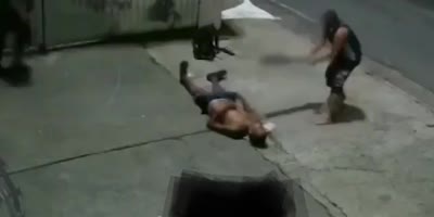 Man gets beat with a pole.