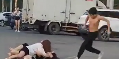 Chinese Couple Fighting In The Street