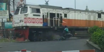 Indonesian Biker Destroyed By Train