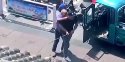 Raging Man Destroys Traffic Inspection Vehicle In China