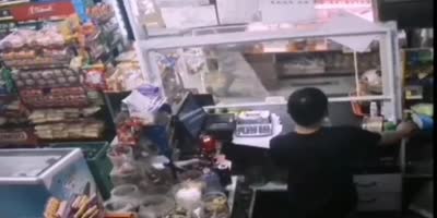 Chinese Store Clerk Shoots Robber
