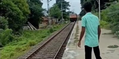 Dude Standing On Train Tracks.