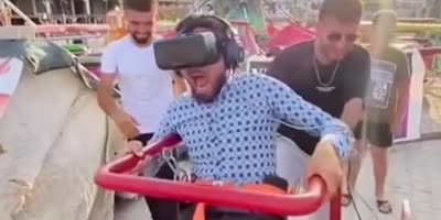 Dude Gets Scared On The Virtual Reality Ride.