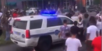 New Orleans: Onlookers jump on NOPD unit while drivers spin donuts