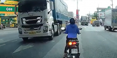 Biker Meets Truck Wheels In Vietnam