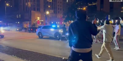 Side Show Spectators Attack Police Car In Chicago