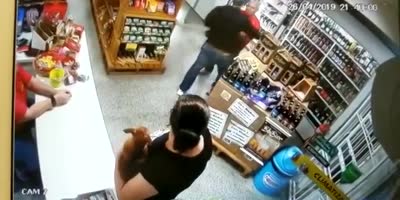 Armed robber shot by clerk during robbery(R)