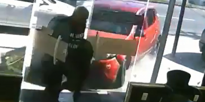 Car hits man inside clothing store