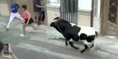 Girl Finds Out You Can't Outrun a Bull in Spain