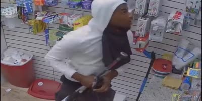 Thug Beats Store Owner With A Baseball Bat During Robbery In Houston.