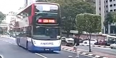Distracted Man Knocked Out By The Bus In Indonesia