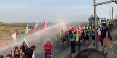 Protesters Against Installation of NATO Antennas Take A Police Shower In Italy