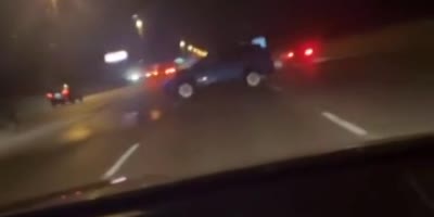 Car Hits Runaway Tire On Highway.