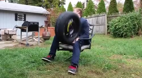 Moron breaks his hand while catching a tire.
